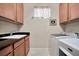 Laundry room with sink, cabinets, granite countertops, washer and dryer at 10213 Saint Francis Ter, Palmetto, FL 34221
