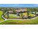 Aerial view of the community lawn games area features a fire pit, bocce ball and putting green, perfect for outdoor enjoyment at 10213 Saint Francis Ter, Palmetto, FL 34221