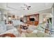 Spacious living room featuring built-in entertainment center and tile flooring at 10213 Saint Francis Ter, Palmetto, FL 34221