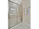 Beautiful glass shower with chrome hardware and light beige tile surround at 10213 Saint Francis Ter, Palmetto, FL 34221