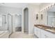 Bathroom features granite counters with double sinks, tiled floor, bathtub, and shower stall at 10810 Moss Island Dr, Riverview, FL 33569