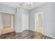 Airy bedroom with laminate floors, multiple access points to bathrooms and closet at 10810 Moss Island Dr, Riverview, FL 33569