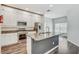 Kitchen featuring granite island with breakfast bar, stainless steel appliances and white cabinetry at 10810 Moss Island Dr, Riverview, FL 33569