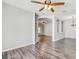 Open concept living area showcases wood floors, arches, and a view into other rooms at 10810 Moss Island Dr, Riverview, FL 33569