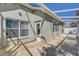 Covered patio area featuring tiled flooring, overhead shade structure, and access to the backyard at 10810 Moss Island Dr, Riverview, FL 33569