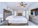 Bedroom featuring ceiling fan, shutters, and outdoor access at 1116 Jacob Way, Odessa, FL 33556