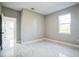 Bright bedroom with large window and ceramic tile flooring at 122 Jennifer Dr, Rotonda West, FL 33947