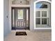 Inviting front door with decorative glass, sidelights, and a welcoming doormat at 12523 River Birch Dr, Riverview, FL 33569