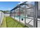 Relaxing screened-in pool with a red umbrella, perfect for outdoor enjoyment at 12523 River Birch Dr, Riverview, FL 33569