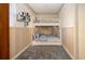 This room features a bunk bed with built in drawers and modern shelving on the walls at 1730 W Del Webb Blvd, Sun City Center, FL 33573