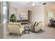 Inviting living room featuring tile floors, neutral tones, and comfortable seating, perfect for relaxation and entertaining at 1730 W Del Webb Blvd, Sun City Center, FL 33573