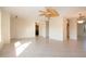Spacious living room featuring neutral tile flooring and plenty of space for entertaining at 1730 W Del Webb Blvd, Sun City Center, FL 33573