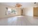 Open living room with tile flooring and a large window providing natural light at 1730 W Del Webb Blvd, Sun City Center, FL 33573