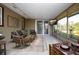 A bright and airy screened patio with comfortable seating and a view of the backyard at 1730 W Del Webb Blvd, Sun City Center, FL 33573