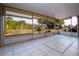 A serene screened patio providing a tranquil view of the outdoors at 1730 W Del Webb Blvd, Sun City Center, FL 33573