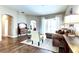 Living area with neutral tones, patterned rug, and sliding glass doors to the outdoors at 17320 Hubers Ct, Odessa, FL 33556