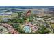 Picturesque community aerial view featuring swimming pools, ponds, and well-kept homes surrounded by trees at 178 Shell Falls Dr, Apollo Beach, FL 33572