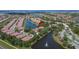 Gorgeous aerial view of a lakeside community with lush landscaping and meticulously maintained lawns at 178 Shell Falls Dr, Apollo Beach, FL 33572