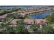 Aerial view of a residential community with homes, lakes, and lush landscaping at 178 Shell Falls Dr, Apollo Beach, FL 33572
