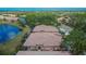 Aerial view showcases community homes, lakes, landscaping, and well-maintained streets at 178 Shell Falls Dr, Apollo Beach, FL 33572