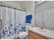 Bathroom featuring a vanity, toilet, and shower with a patterned shower curtain at 178 Shell Falls Dr, Apollo Beach, FL 33572
