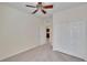 Bedroom featuring carpet flooring, a closet, and a view to the kitchen at 178 Shell Falls Dr, Apollo Beach, FL 33572