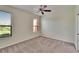 Bedroom with blinds, ceiling fan, and plush carpet flooring at 178 Shell Falls Dr, Apollo Beach, FL 33572