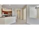 Spacious kitchen showcases stainless steel refrigerator, dark cabinets and tile flooring at 178 Shell Falls Dr, Apollo Beach, FL 33572