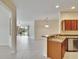 Open concept, showcasing the kitchen and view to the living room and outdoor seating at 178 Shell Falls Dr, Apollo Beach, FL 33572