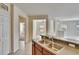 Open kitchen featuring a stainless steel sink, tile flooring, and neutral walls at 178 Shell Falls Dr, Apollo Beach, FL 33572