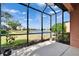 Relax on the screened lanai with beautiful views of the lake and blue skies at 178 Shell Falls Dr, Apollo Beach, FL 33572