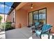 Enjoy outdoor living on this cozy lanai with comfortable seating and ceiling fan at 178 Shell Falls Dr, Apollo Beach, FL 33572