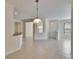 Open floor plan living space with tiled floor and views to kitchen area at 178 Shell Falls Dr, Apollo Beach, FL 33572