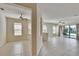 Living room featuring neutral walls, tile flooring, and outdoor views at 178 Shell Falls Dr, Apollo Beach, FL 33572