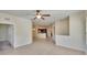 Open-concept living area with views to the kitchen area, tile flooring, and neutral paint at 178 Shell Falls Dr, Apollo Beach, FL 33572