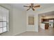 Living room featuring tile floors, natural light, and a passthrough to the kitchen at 178 Shell Falls Dr, Apollo Beach, FL 33572