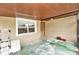 Wide angle view of screened back porch, weathered floor, and exterior access at 1819 Shore Acres Ne Blvd, St Petersburg, FL 33703