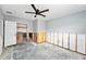 Spacious bedroom featuring a ceiling fan and an open closet, undergoing renovation at 1819 Shore Acres Ne Blvd, St Petersburg, FL 33703