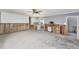 Bright, open-concept space with tiled flooring leading to a modern kitchen with white cabinets at 1819 Shore Acres Ne Blvd, St Petersburg, FL 33703