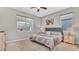 Cozy bedroom with neutral walls, a comfortable bed, and bedside tables, creating a serene and relaxing atmosphere at 19437 Ship Wheel Way, Land O Lakes, FL 34638