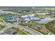 Overhead shot of the community clubhouse, pool, tennis courts, and manicured landscaping at 19437 Ship Wheel Way, Land O Lakes, FL 34638