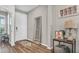 Inviting entryway with wood floors, a decorative rug, mirror and stylish decor at 19437 Ship Wheel Way, Land O Lakes, FL 34638