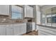 Stylish kitchen area featuring stainless steel appliances, a sink, and lots of counter space, perfect for culinary enthusiasts at 19437 Ship Wheel Way, Land O Lakes, FL 34638