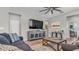 Comfortable living room showcasing hardwood floors, a ceiling fan, modern decor, and lots of space for relaxing and entertaining at 19437 Ship Wheel Way, Land O Lakes, FL 34638
