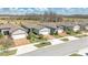 Charming street view showcases well-maintained homes with colorful driveways and manicured landscaping at 19437 Ship Wheel Way, Land O Lakes, FL 34638