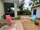 Comfortable backyard with patio seating, landscaped garden, and access to a detached garage at 208 W Amelia Ave # 1, Tampa, FL 33602