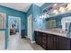 A bathroom featuring a double vanity with a granite countertop and a tile floor at 208 W Amelia Ave # 1, Tampa, FL 33602