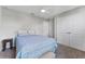 Bedroom features a double bed, ceiling fan, neutral carpet and a window that provides ample natural light at 208 W Amelia Ave # 1, Tampa, FL 33602