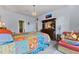 Cozy bedroom with an antique dresser, colorful bedspread, and comfortable seating area at 208 W Amelia Ave # 1, Tampa, FL 33602