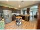 A spacious kitchen features dark cabinets, stainless steel appliances, and granite countertops at 208 W Amelia Ave # 1, Tampa, FL 33602